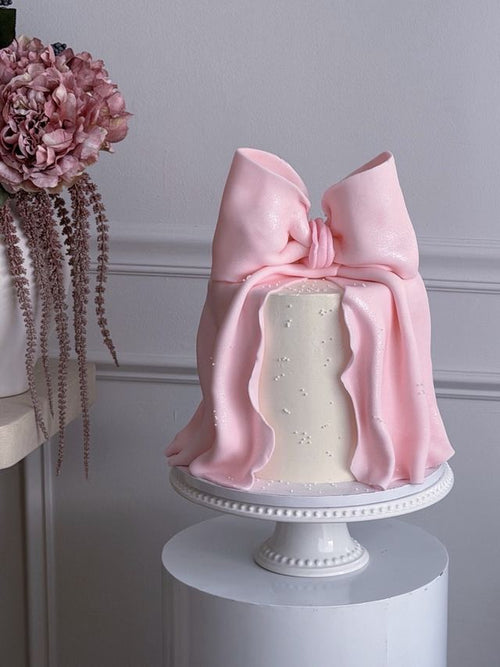 Pink fondant bow cake